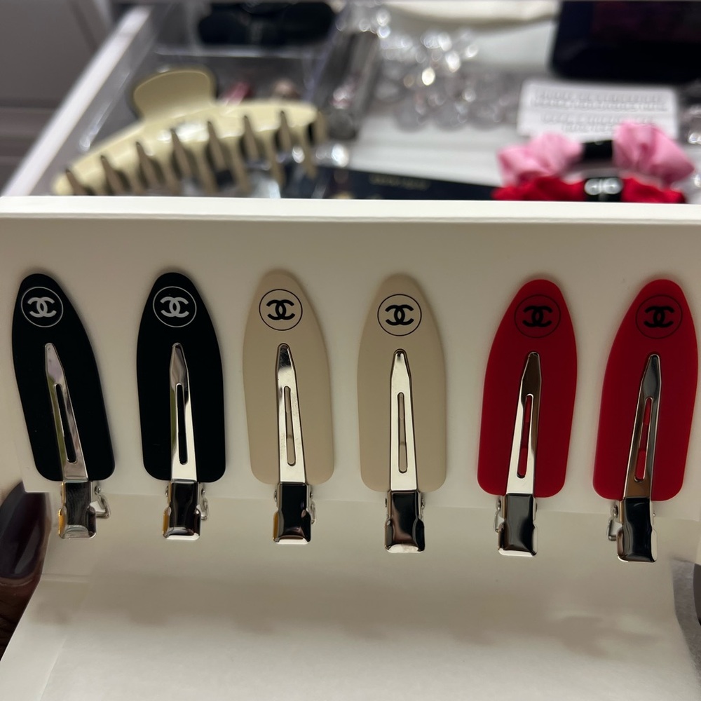 CHANEL Black, Cream, and Red Hair Clips